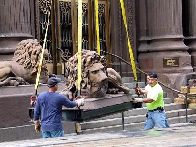 The Stone Lions being taken for restoration.