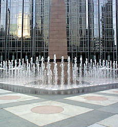 The fountain surrounding the obelisk in summertime.
