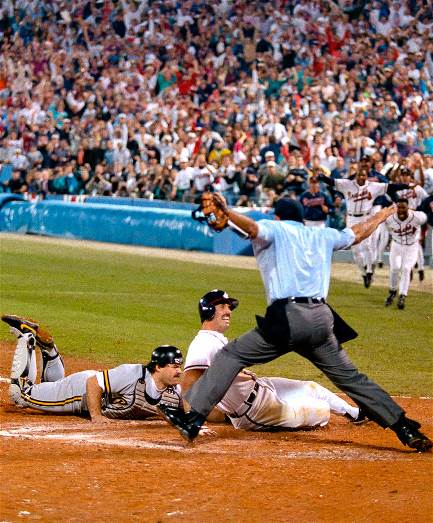 Former Pirate Sid Bream slides in safely at home
to beat the Pirates in Game 7 of the NLCS in 1992.