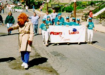 McGruff
 the Crimedog clears the way for Miggantz and Labriola