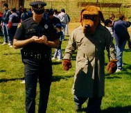 Officer
 O'Neill and the Crimedog take careful notes while judging the banner
 entries