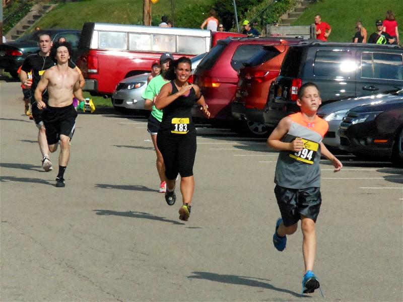 Runners approach the finish line.