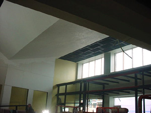 Windows, windows, everywhere.
This is a view from the front room
looking back towards the stairwell
and the front door.