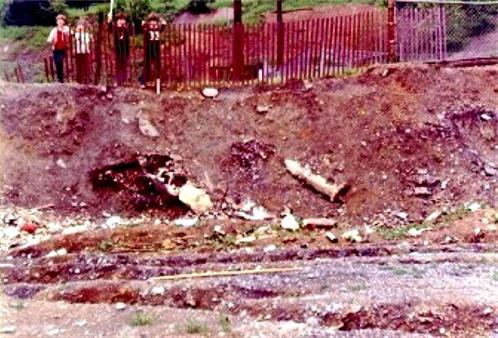 Picture of landscape
 behind fields.