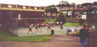 Photo of
 outdoor summer basketball league action.